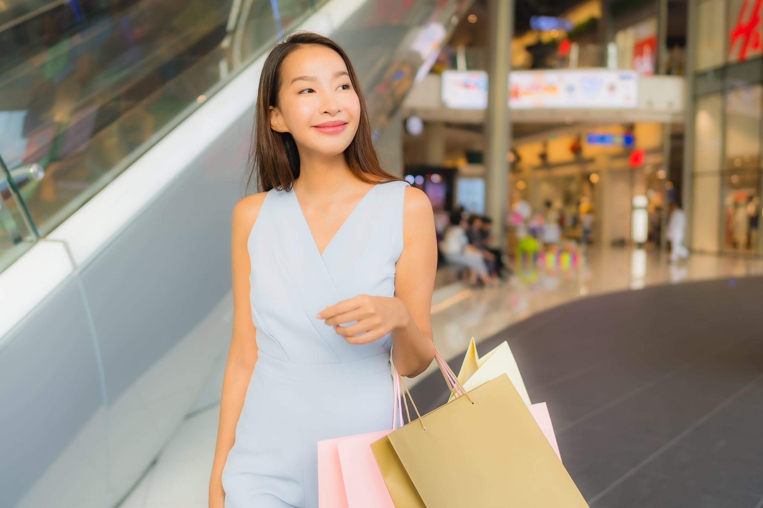 Portrait beautiful young asian woman happy and smile with shoppi